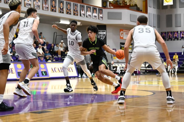 Prolific Prep's Tyran Stokes drives into the lane against the defense of Riviera Prep's Peter Okechukwu (10), Dante Allen (35), Gustavo Gulmaraes Alves (11) and Mason Fuentes (2).